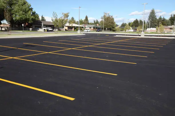 Freshly paved and striped commercial parking lot in Greater Lansing, Michigan